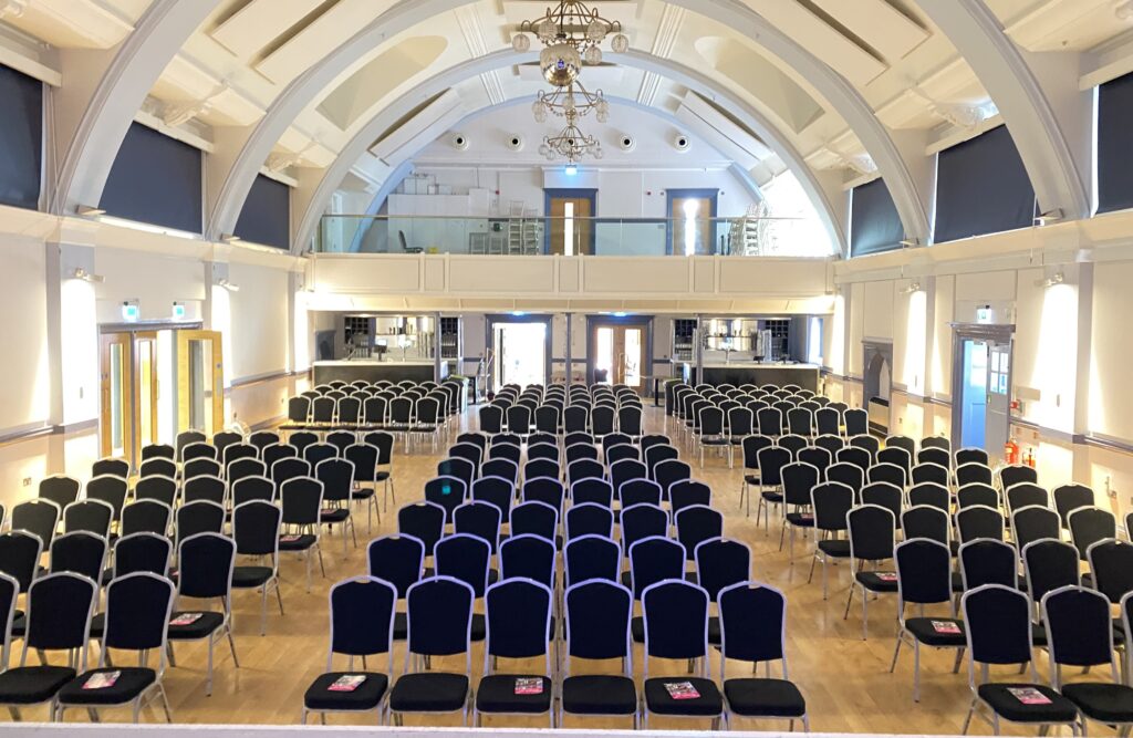 Theatre style seating for more than 200 people in a venue hall